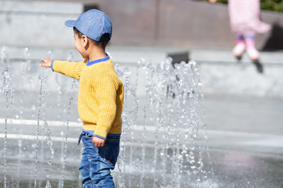 Child playing in the fountain maze at Merchant Square